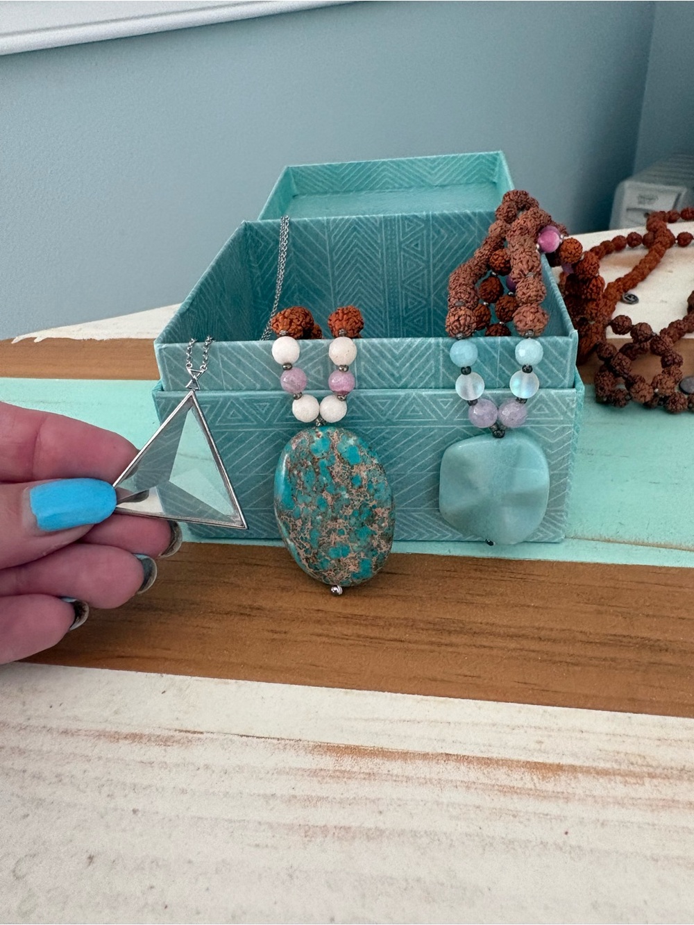 Three tiny devotions necklaces - two malas and one silver triangle necklace